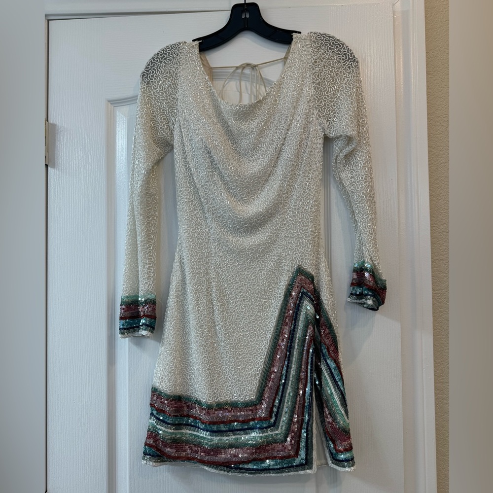 Second hand Sherri hill sz 2 spray tan in inside and couple sequins missing